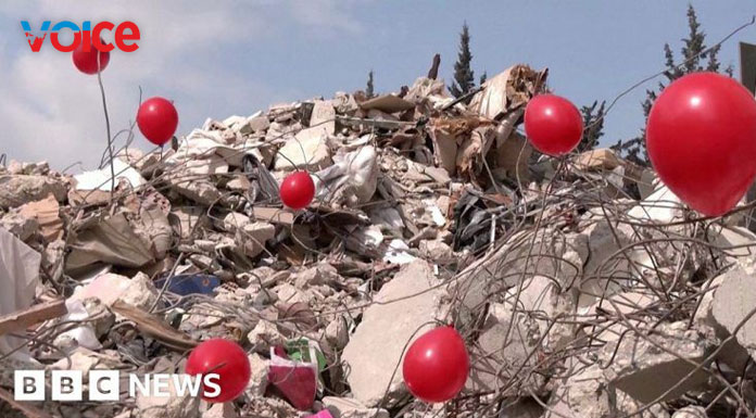 Red balloons placed on rubble to honour child victims in Turkey